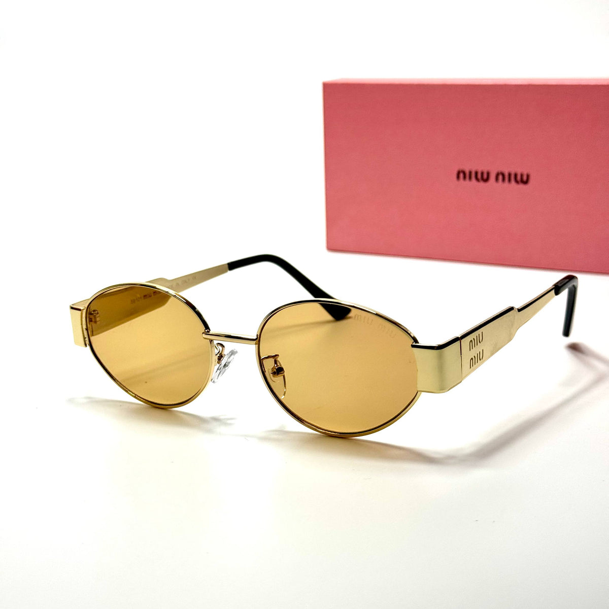 Miu Miu Round SMU50Y Gold Amber women's sunglasses Lebanon - slim gold-tone metal frame, warm amber lenses - ChronoVault