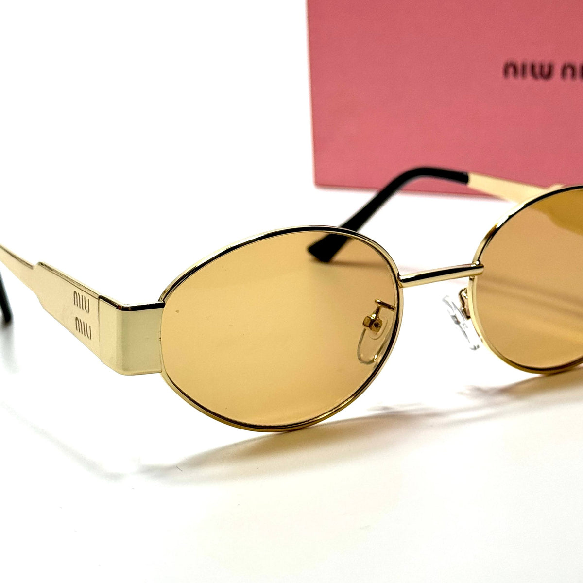 Miu Miu Round SMU50Y Gold Amber women's sunglasses Lebanon - slim gold-tone metal frame, warm amber lenses - ChronoVault - view 2