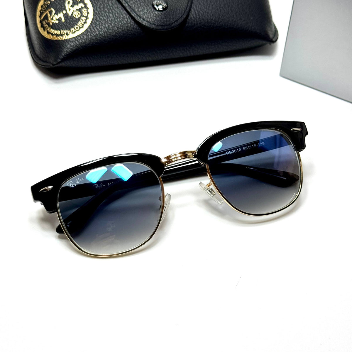 Ray-Ban Clubmaster RB3016 Blue Gradient unisex sunglasses Lebanon - black with gold metal detailing frame, blue gradient lenses - ChronoVault - view 3