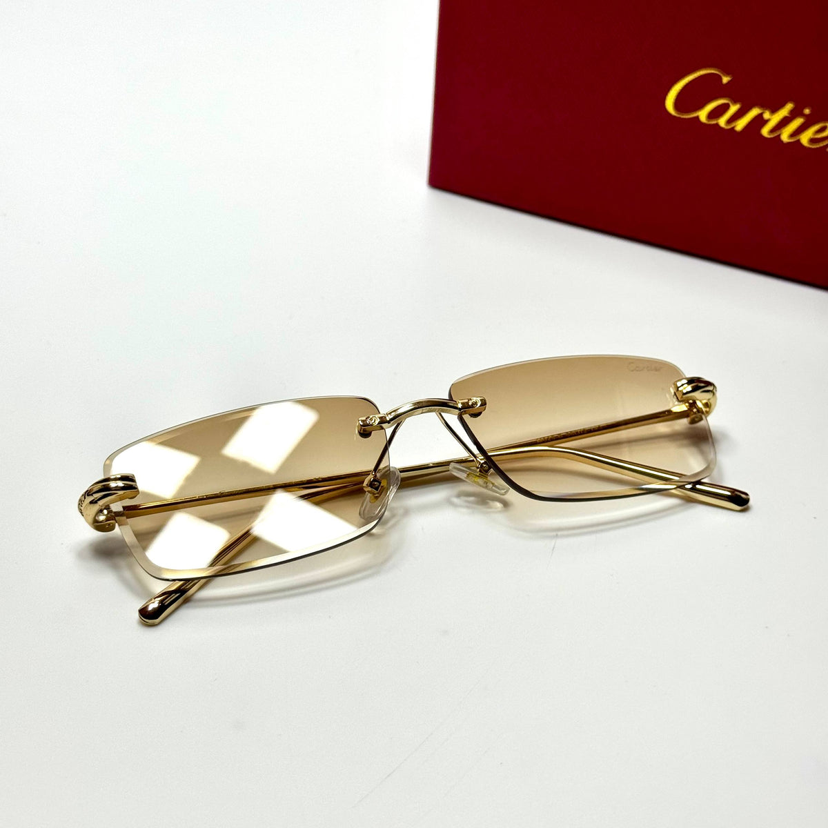 Cartier Rimless CT0092O Gold Champagne unisex sunglasses Lebanon - polished gold-tone metal frame, champagne gradient lenses - ChronoVault - view 4