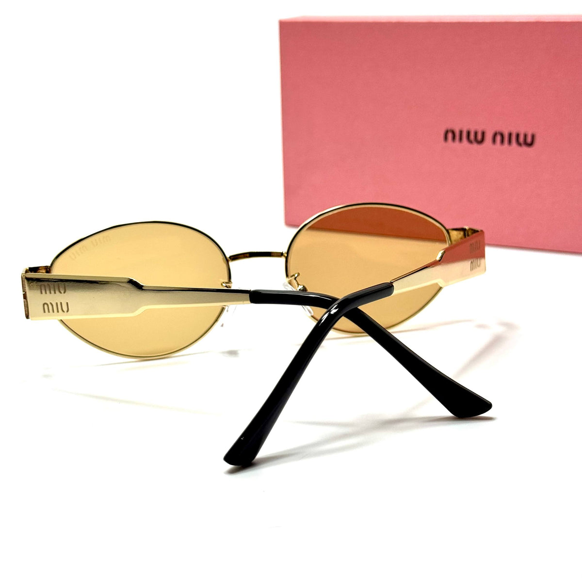 Miu Miu Round SMU50Y Gold Amber women's sunglasses Lebanon - slim gold-tone metal frame, warm amber lenses - ChronoVault - view 3