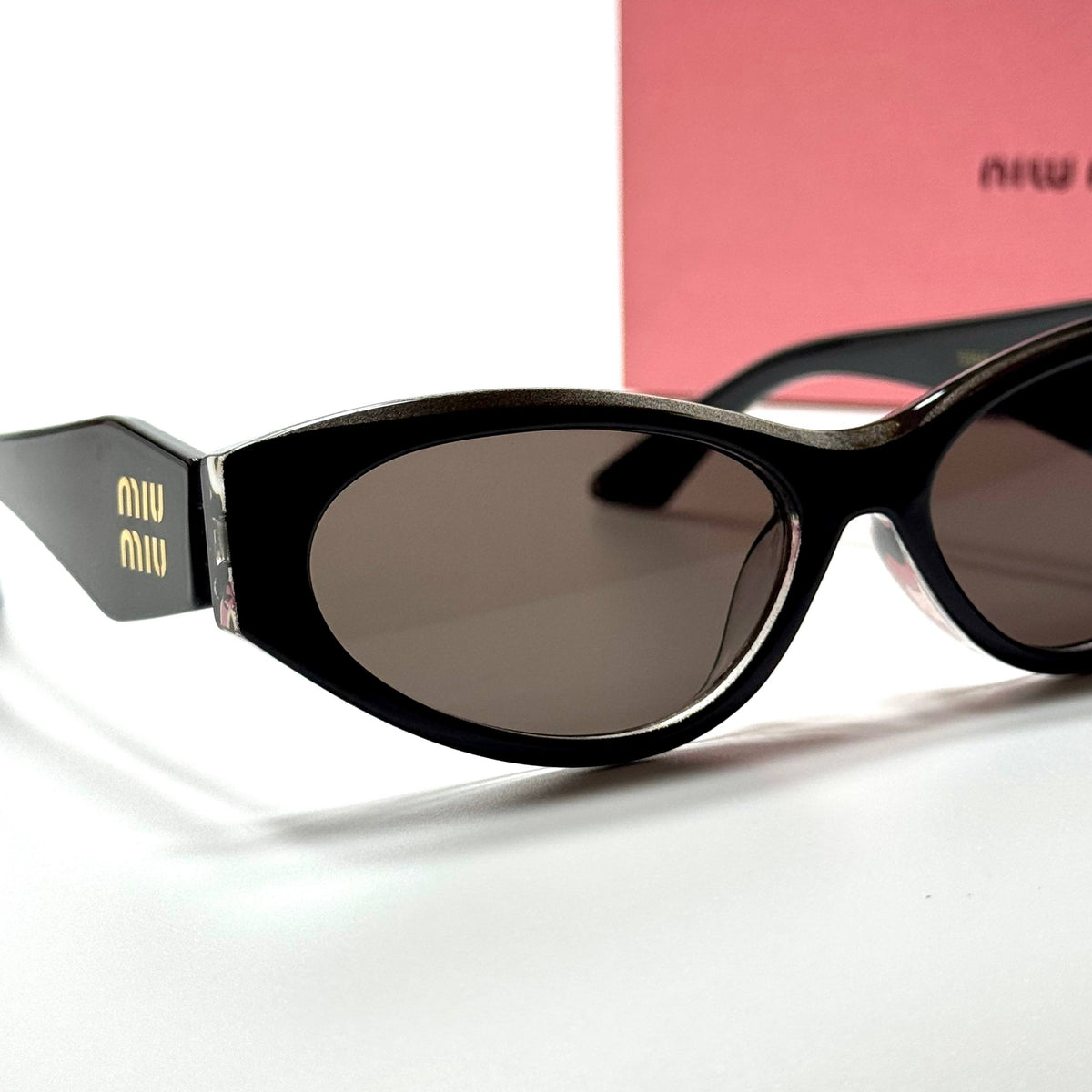 Miu Miu Cateye MU11ZS Black Brown women's sunglasses Lebanon - glossy black with gold miu miu temple detailing frame, dark brown lenses - ChronoVault - view 2