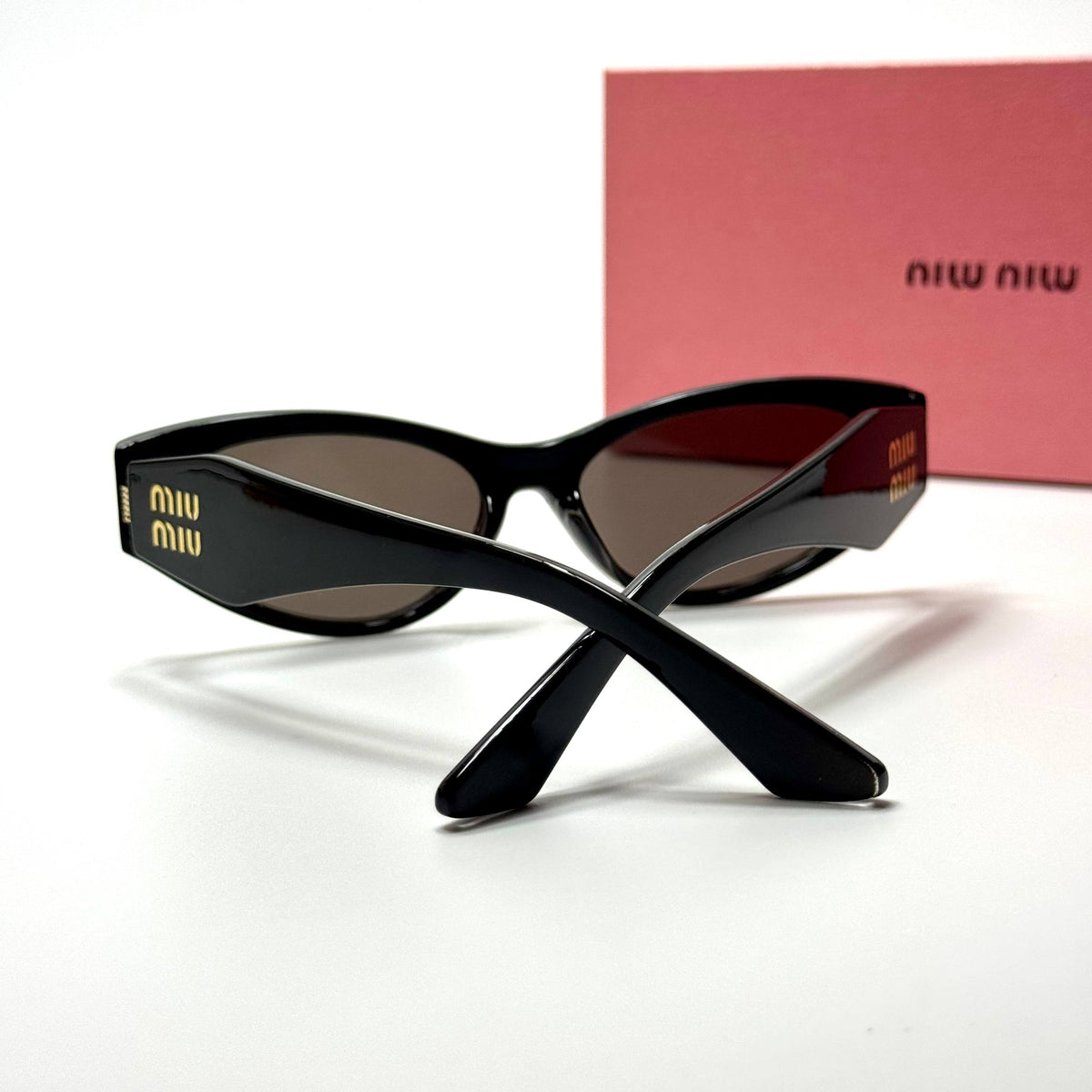 Miu Miu Cateye MU11ZS Black Brown women's sunglasses Lebanon - glossy black with gold miu miu temple detailing frame, dark brown lenses - ChronoVault - view 4