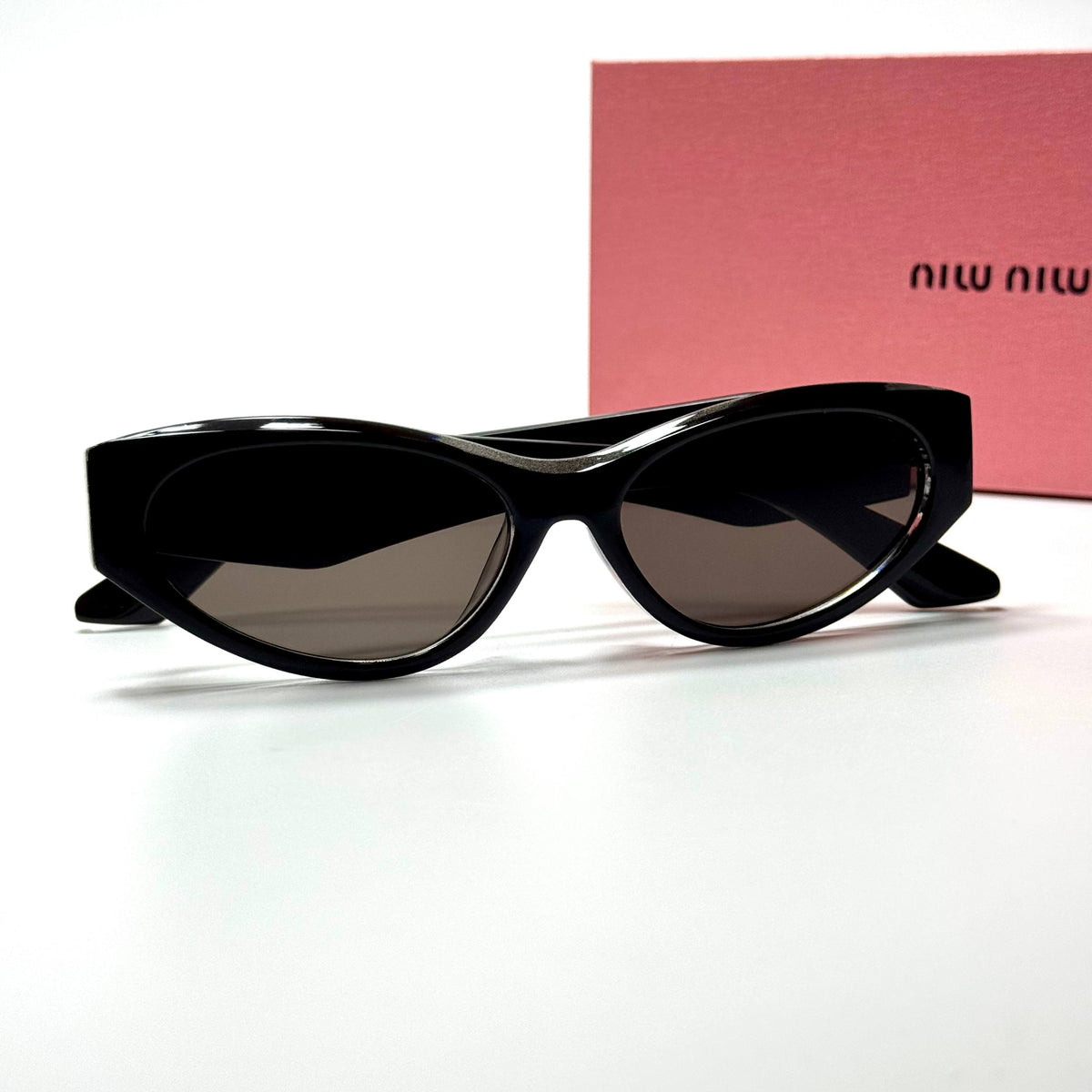 Miu Miu Cateye MU11ZS Black Brown women's sunglasses Lebanon - glossy black with gold miu miu temple detailing frame, dark brown lenses - ChronoVault - view 3