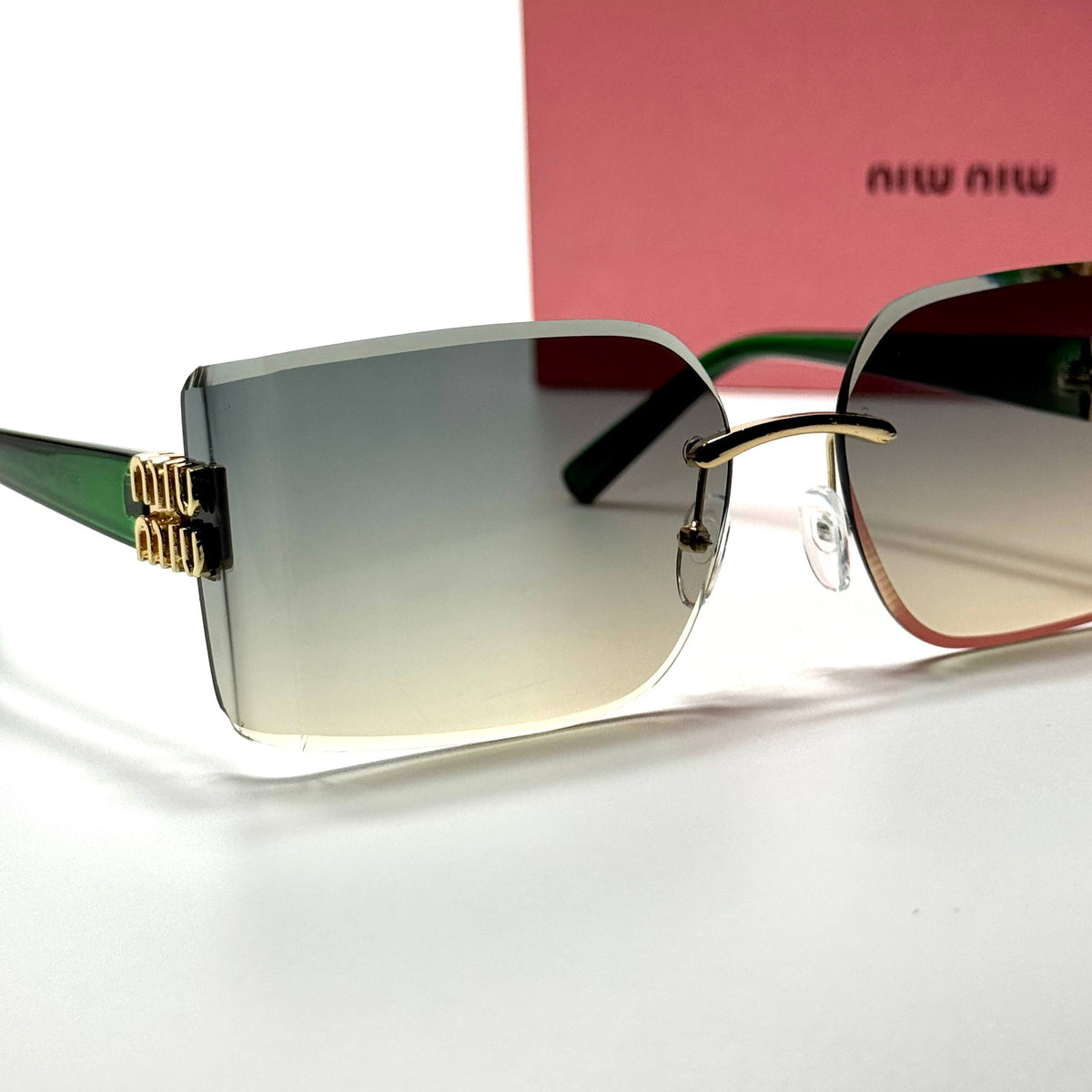 Miu Miu Rimless Rectangular MU09YS Green Gradient women's sunglasses Lebanon - green temples with gold miu miu detailing frame, green gradient lenses - ChronoVault - view 2