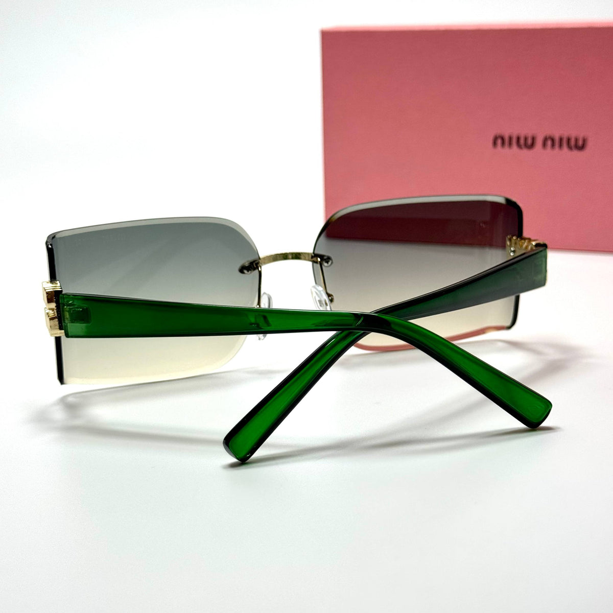 Miu Miu Rimless Rectangular MU09YS Green Gradient women's sunglasses Lebanon - green temples with gold miu miu detailing frame, green gradient lenses - ChronoVault - view 3