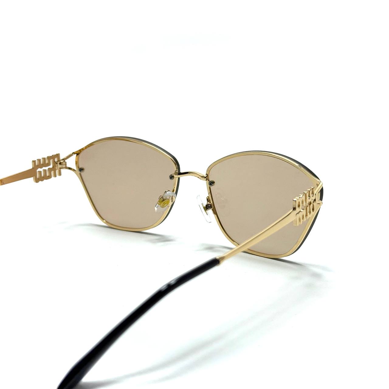 Miu Miu Cat-Eye Metal Gold Champagne Bronze Sunglasses Angle Lebanon – ChronoVault